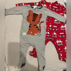 3-6 months Tiger Footsie is by Gerber and Firetruck is by wonder Nation